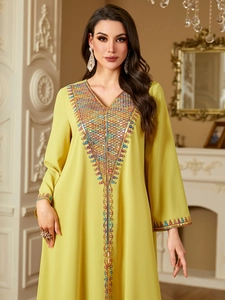 Elegant lemon yellow kaftan dress with intricate sequin embroidery and a classic V-neckline