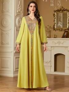 Elegant ginger yellow Kaftan maxi dress with colorful ethnic embroidery and long sleeves