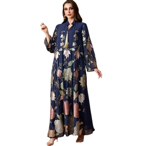 Navy blue kaftan dress with floral embroidery, stand collar, and gold tassel charm