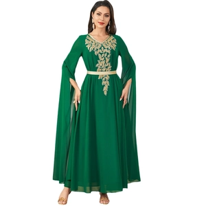 Elegant emerald green maxi dress with gold leaf embroidery and cape-style split sleeves