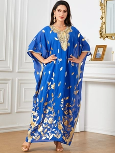 Blue kaftan maxi dress with gold leaf patterns and batwing sleeves in boho style