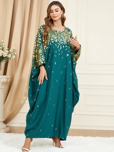 Elegant emerald green kaftan dress with golden floral prints in a loose plus size fit
