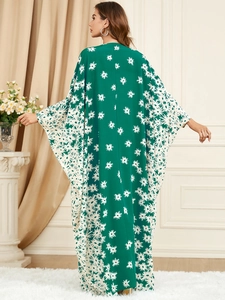 Green kaftan maxi dress with white daisy floral print and loose batwing sleeves