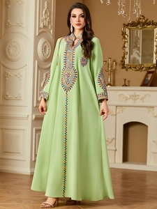 Elegant light green ethnic long dress with intricate embroidery and long sleeves