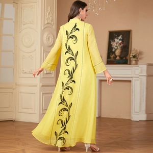 Elegant long yellow robe dress with intricate black embroidery on the back and long sleeves