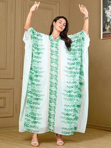 Plus size loose kaftan maxi dress with green leaf print and V-neck batwing sleeves