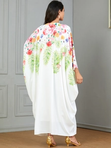 Elegant white maxi dress with colorful floral print and lightweight flowing fabric for women