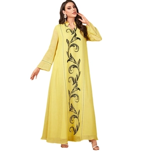 Elegant yellow long-sleeved Abaya dress with black floral vine embroidery and V-neckline