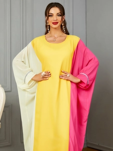 Detail of batwing sleeves with silver rhinestone trim on a tri-color kaftan dress