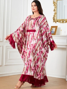 Elegant red kaftan dress with batwing sleeves, artistic print, and luxury fringe trim