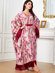 Elegant batwing sleeve long dress with abstract prints and stylish fringe trim and belt