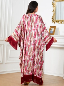 Women's batwing sleeve long dress with bohemian abstract print and red tassel details