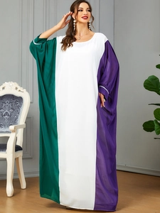Detail of color block maxi dress with green, white, purple panels and sequin cuffs