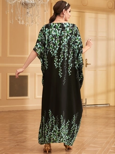Ethnic bohemian long kaftan dress with green floral print on black fabric