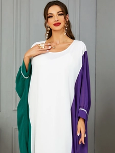 Detailed close-up of crystal-embellished cuffs on a three-color patchwork modest abaya dress