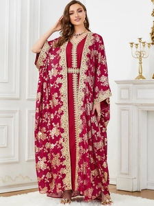 Close-up of luxury red kaftan set featuring heavy gold floral embroidery and sequins