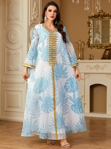 Elegant white kaftan dress with blue leaf prints and golden embroidery at V-neckline