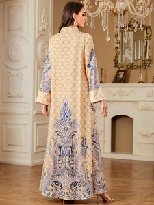 Detailed back view of an ethnic kaftan featuring intricate paisley prints and satin texture
