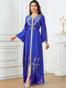 Elegant royal blue Moroccan kaftan with gold floral embroidery and fringed hemline