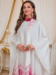 Detailed view of white Jalabiya with purple wave print and high-gloss satin texture