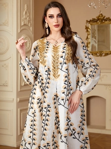Robe maxi élégante à fleurs et manches longues avec broderie pailletée dorée
