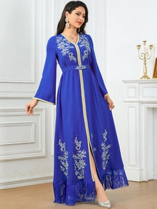 Elegant royal blue kaftan dress with gold floral embroidery and stylish long tassels