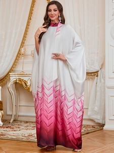 Close-up of elegant gradient Kaftan dress with geometric V-pattern and silky texture