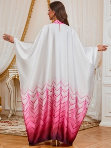 Detail of the high-neck back opening on this red gradient silk Kaftan dress