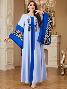 Elegant light and royal blue kaftan dress with sequin embroidery and a waist bow