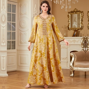Elegant mustard yellow kaftan dress with golden floral jacquard and intricate beaded embroidery