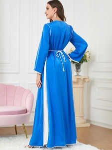 Elegant royal blue long-sleeved kaftan dress with white piping and braided belt detail