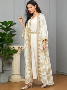 Detailed golden floral embroidery on an elegant white kaftan two-piece dress for women