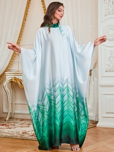 Detail of elegant gradient Jalabiya dress with silk-like satin texture and batwing sleeves