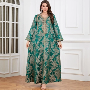 Emerald green kaftan evening gown with gold floral embroidery and sequin V-neckline
