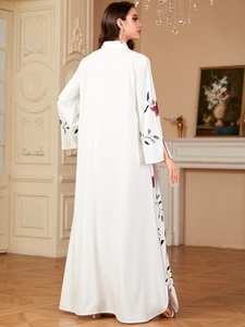 Elegant white long sleeve dress with floral embroidery and modest high neck collar
