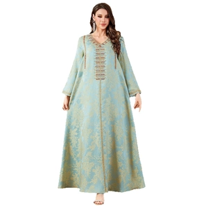 Light blue Kaftan evening dress with gold floral embroidery and intricate beadwork details