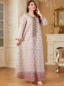 Elegant Abaya long sleeve dress with red geometric print and gold chest embroidery