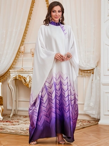 Detail of elegant gradient kaftan dress with long sleeves and geometric pattern texture