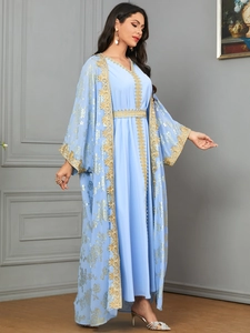 Detailed embroidery and gold lace edging on light blue Arabian Abaya two-piece set