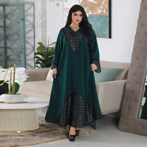 Detail of dark green abaya featuring intricate black sequin embroidery on neck and sleeves