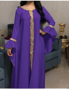Detailed view of the purple kaftan dress featuring gold sequin embroidery on wide flared sleeves