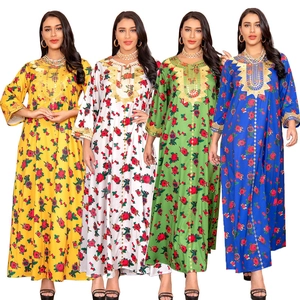 Close-up of elegant floral kaftan dresses with intricate gold embroidery and sequins
