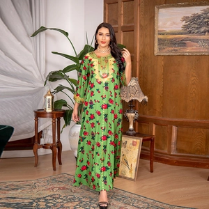Elegant green kaftan dress with red floral print and gold embroidery detail