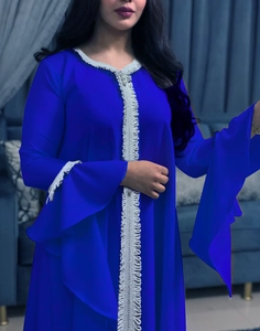 Detail of royal blue chiffon abaya with silver floral lace embroidery and flared sleeves