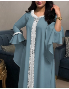Detail of white lace embroidery on blue lotus leaf sleeve abaya dress