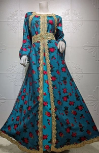 Intricate gold lace trim and floral embroidery on a blue ethnic kaftan maxi dress