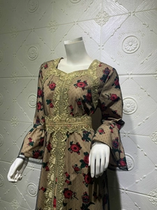 Detailed embroidery on mesh fabric of the khaki kaftan dress with red floral patterns