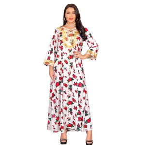 Detail of floral kaftan maxi dress with gold sequin embroidery on neckline and cuffs