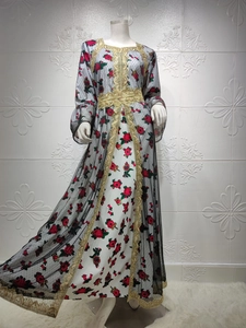 Close-up of golden embroidery and floral prints on the ethnic mesh kaftan dress