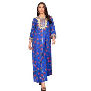 Detail of royal blue ethnic maxi dress featuring intricate gold embroidery and floral patterns